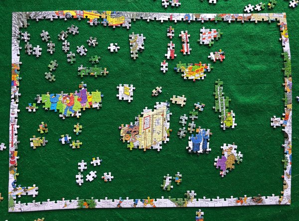 puzzel-1000-stukjes-jan-van-haasteren-kerstbomen-markt-op-puzzelmat-na-1-uur-gelegd-600-444